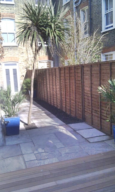 sandstone-paving-patio-installation-london-paving-side-return-small-garden.jpg