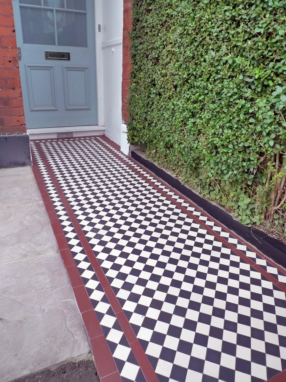 front-garden-tile-path-mosaic-with-red-strips-and-black-and-white-tiles-london.JPG