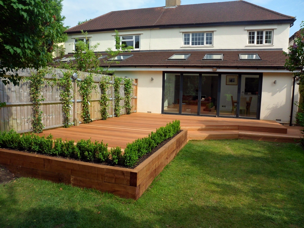 hardwood deck with railway sleepr raised bed and steps london decking installation