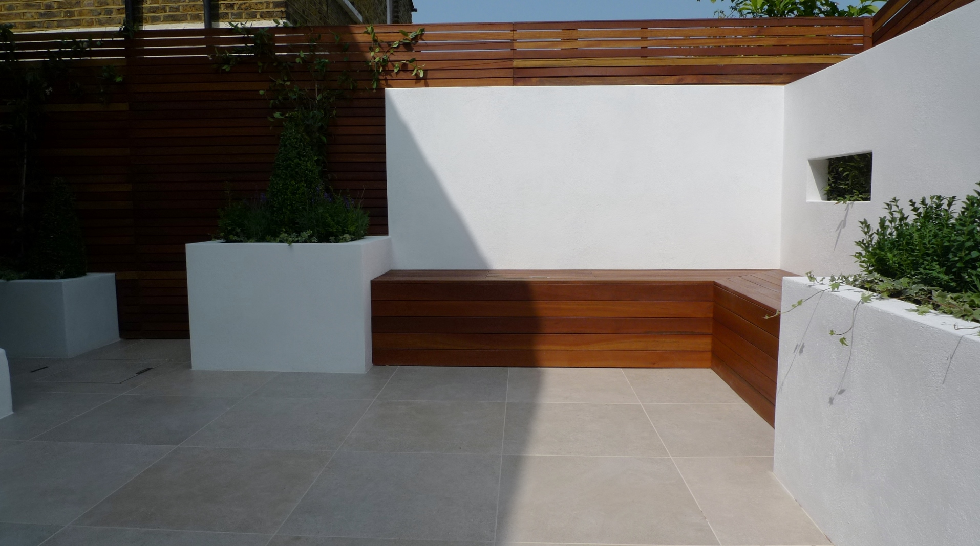 hardwood storage bench raised block rendered walls stunning garden design ideas london