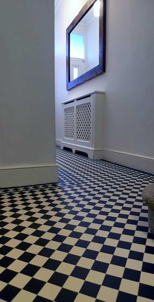 hallway black and white mosaic tile path with diamond border London