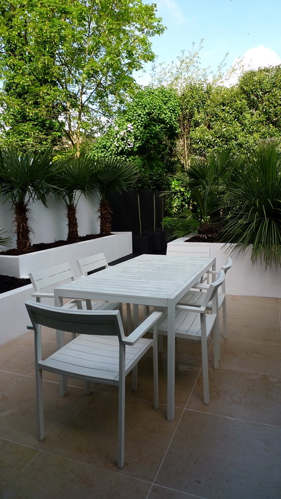 Modern Urban London Garden Design limestone paving white raised beds black decking architectural planting (7)