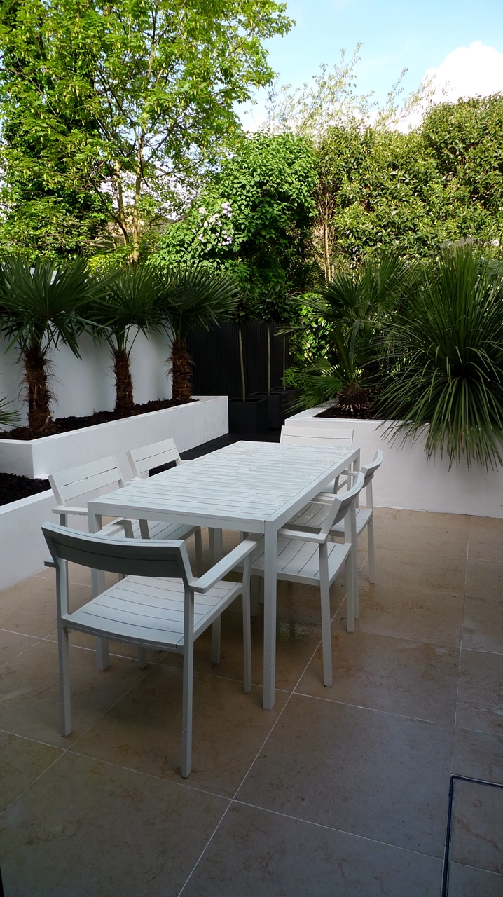 Modern Urban London Garden Design limestone paving white raised beds black decking architectural planting (8)
