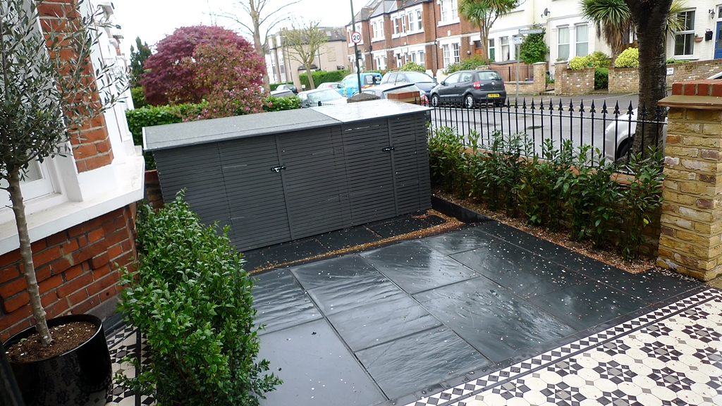 yellow brick london garden wall slate paving mosaic tile path metal rail
