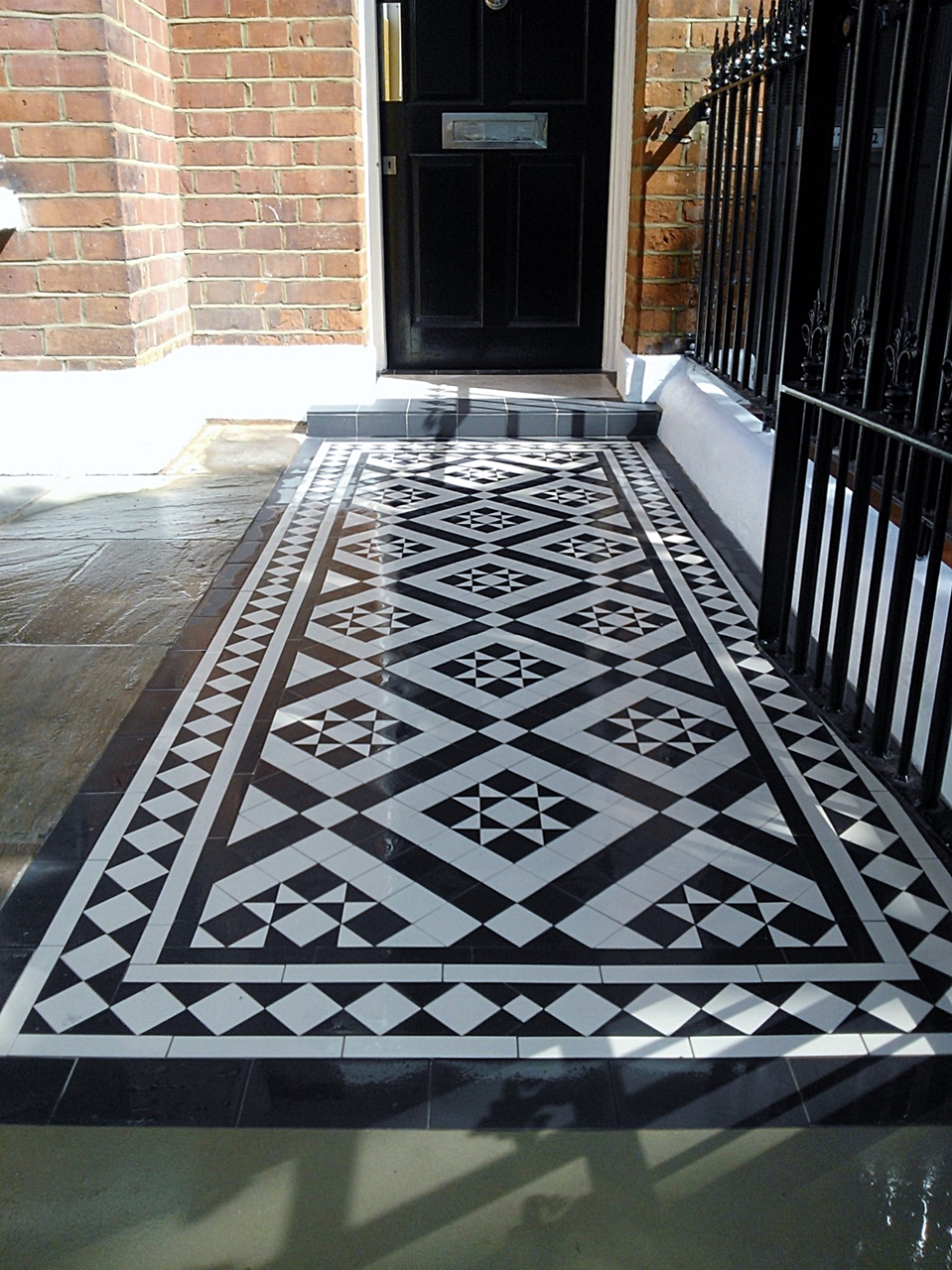 black and white victorian mosaic tile path london