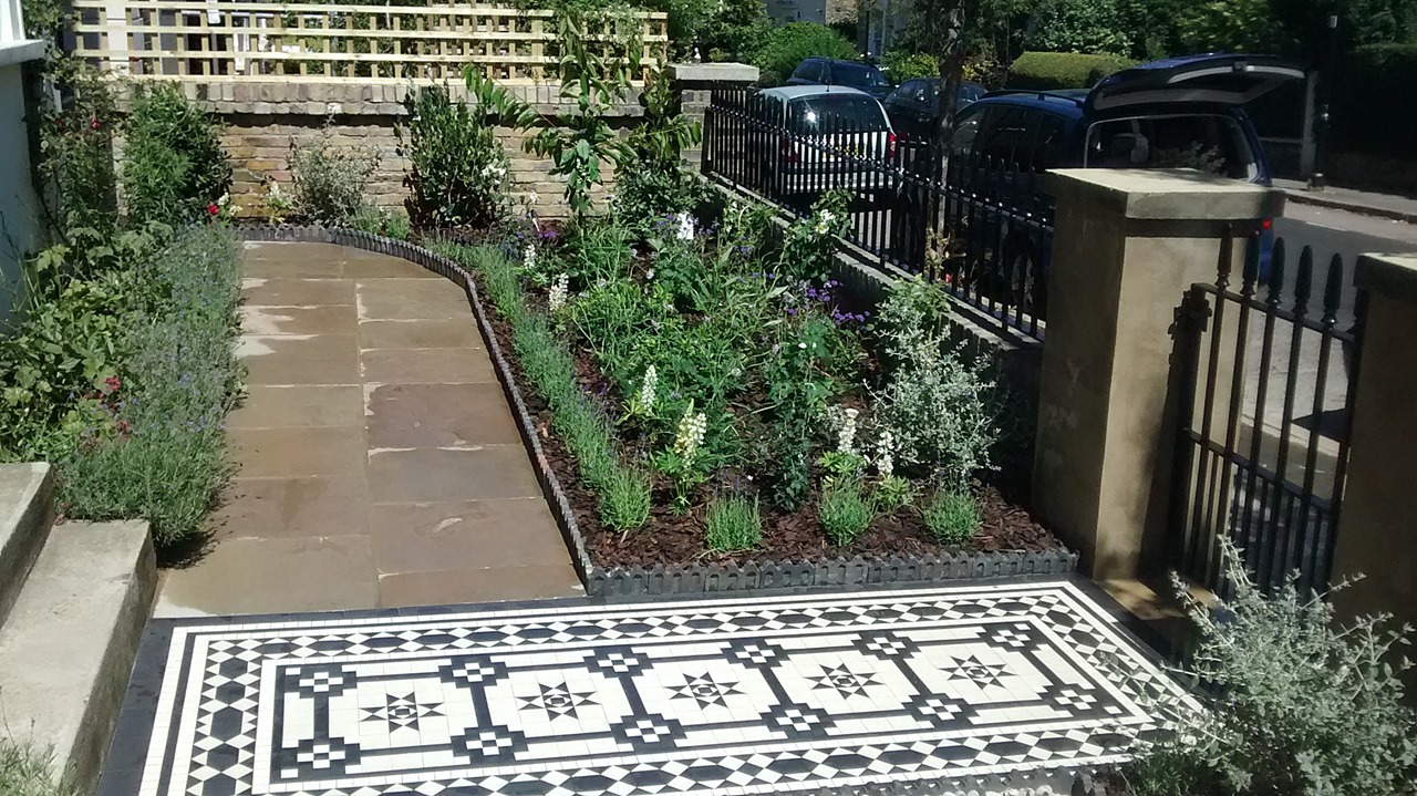 cool victorian black and white mosaic tile path islington london