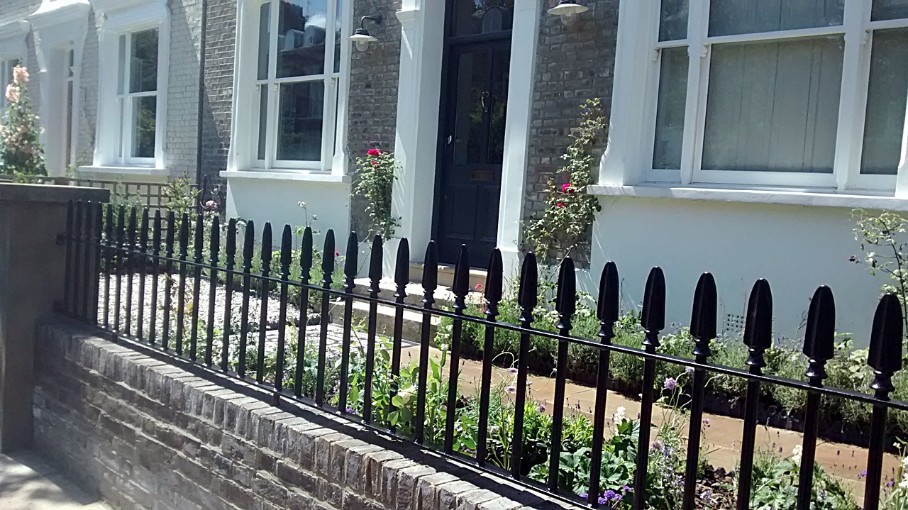 heavy spear metal gate and railon imperial yellow brick garden wall islington london