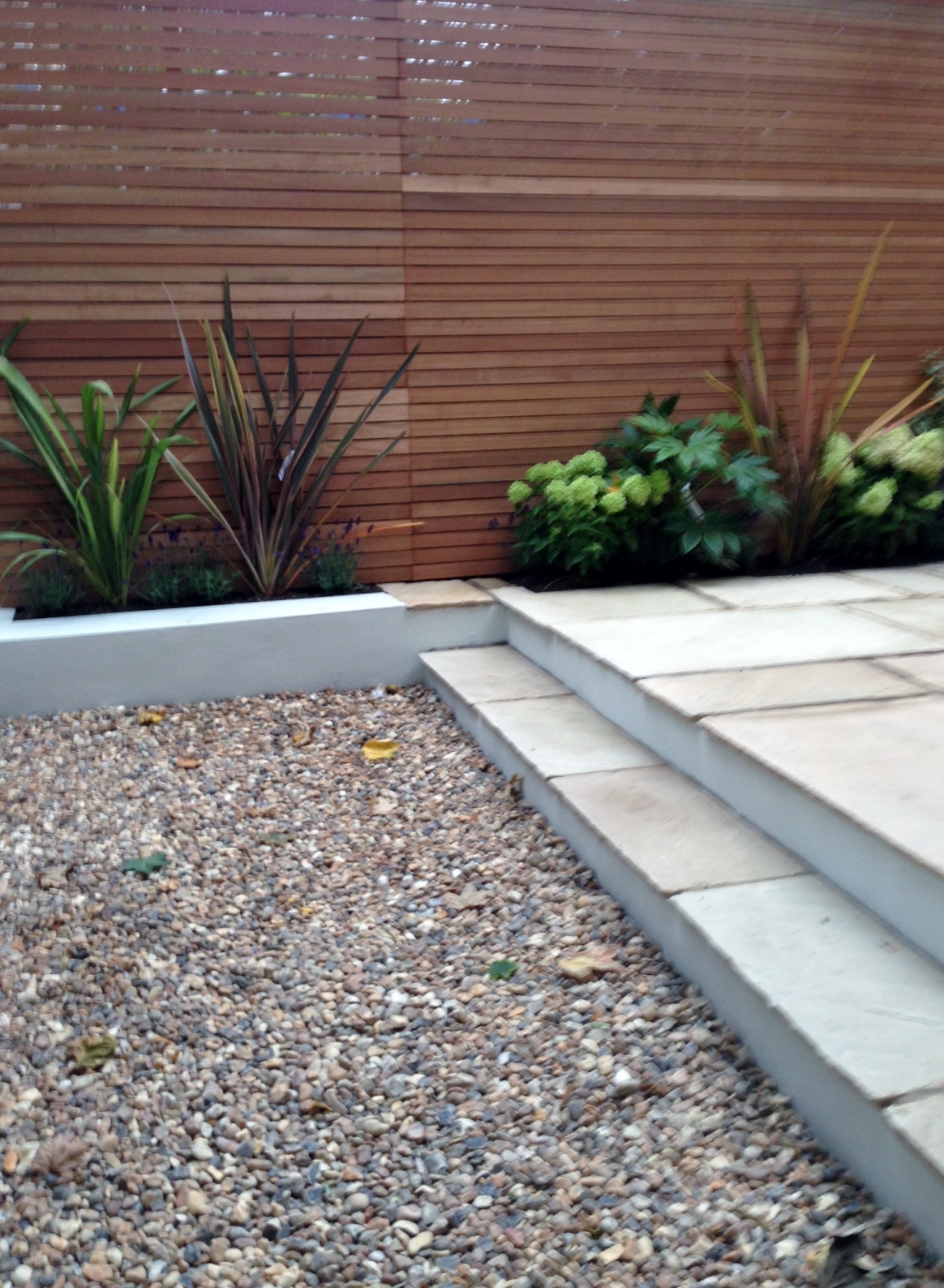 clapham garden design sandstone paving hardwood privacy screen shingle trellis fence modern low maintenance ideas (14)