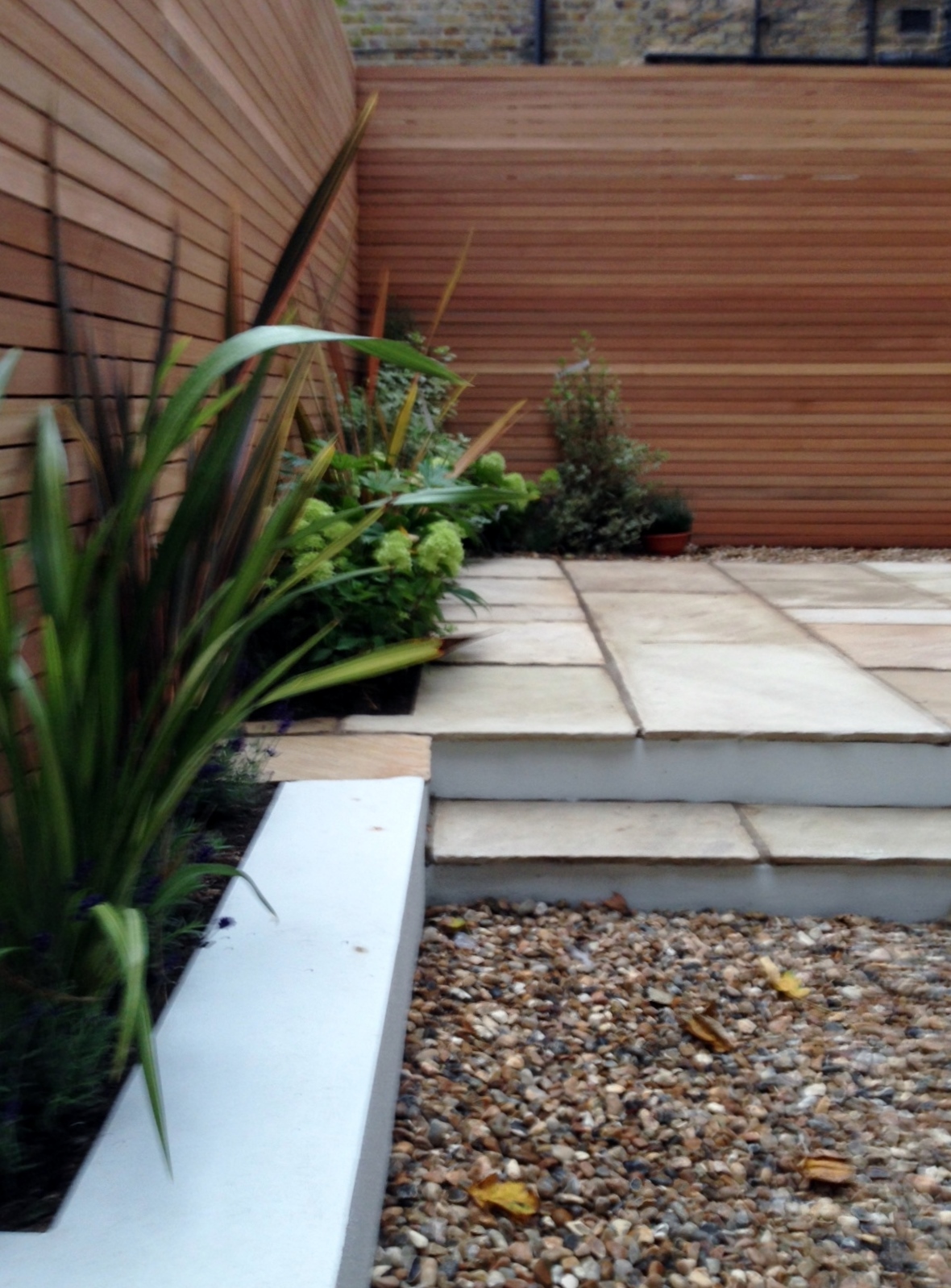 clapham garden design sandstone paving hardwood privacy screen shingle trellis fence modern low maintenance ideas (17)