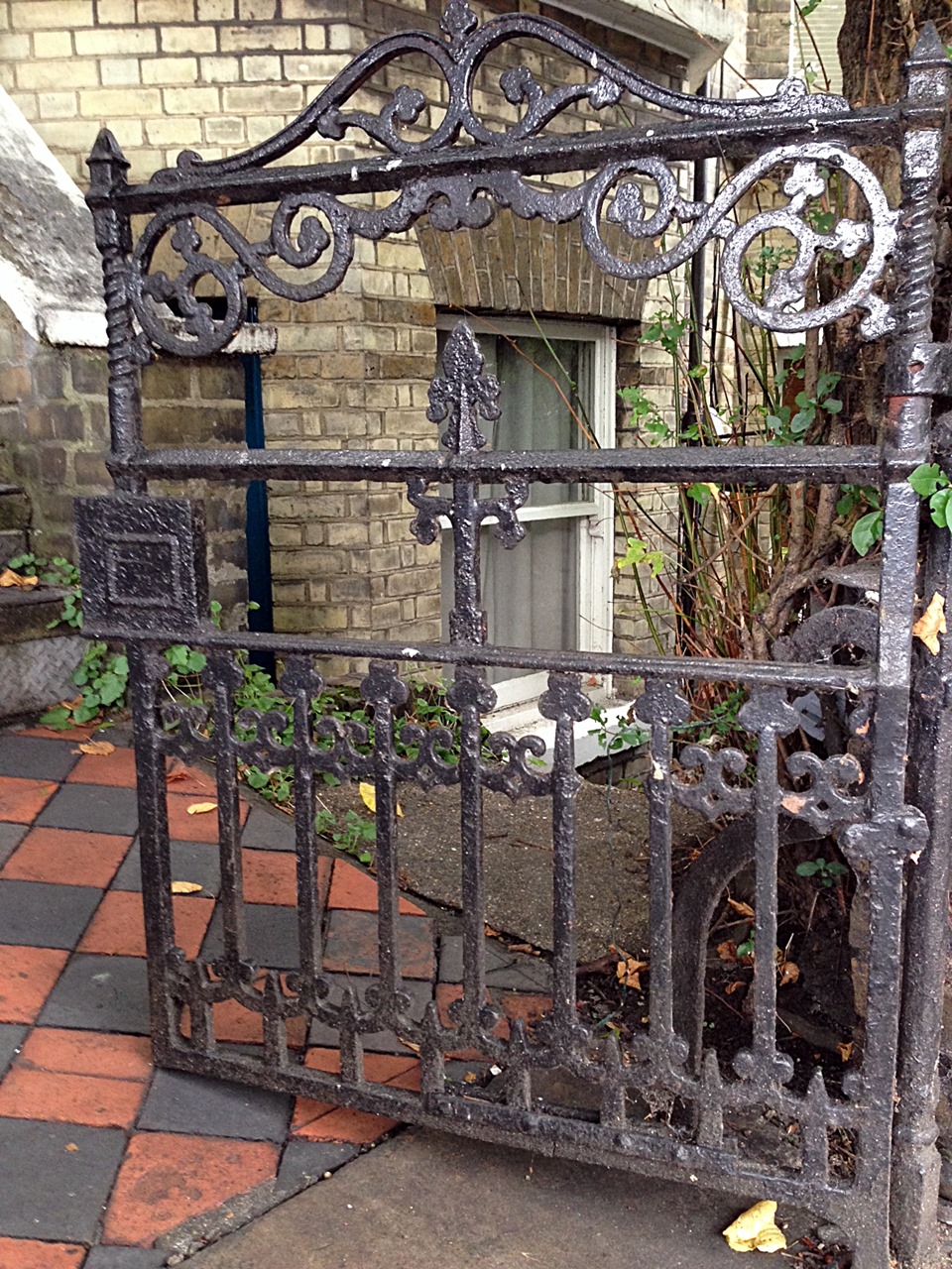 victorian original wrought iron roll back gate with old York stone quarry tile path and original London Stock brick wall Putney West Hill London# (4)