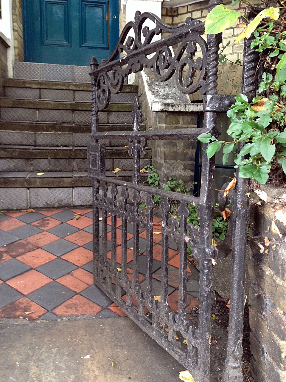 victorian original wrought iron roll back gate with old York stone quarry tile path and original London Stock brick wall Putney West Hill London# (6)