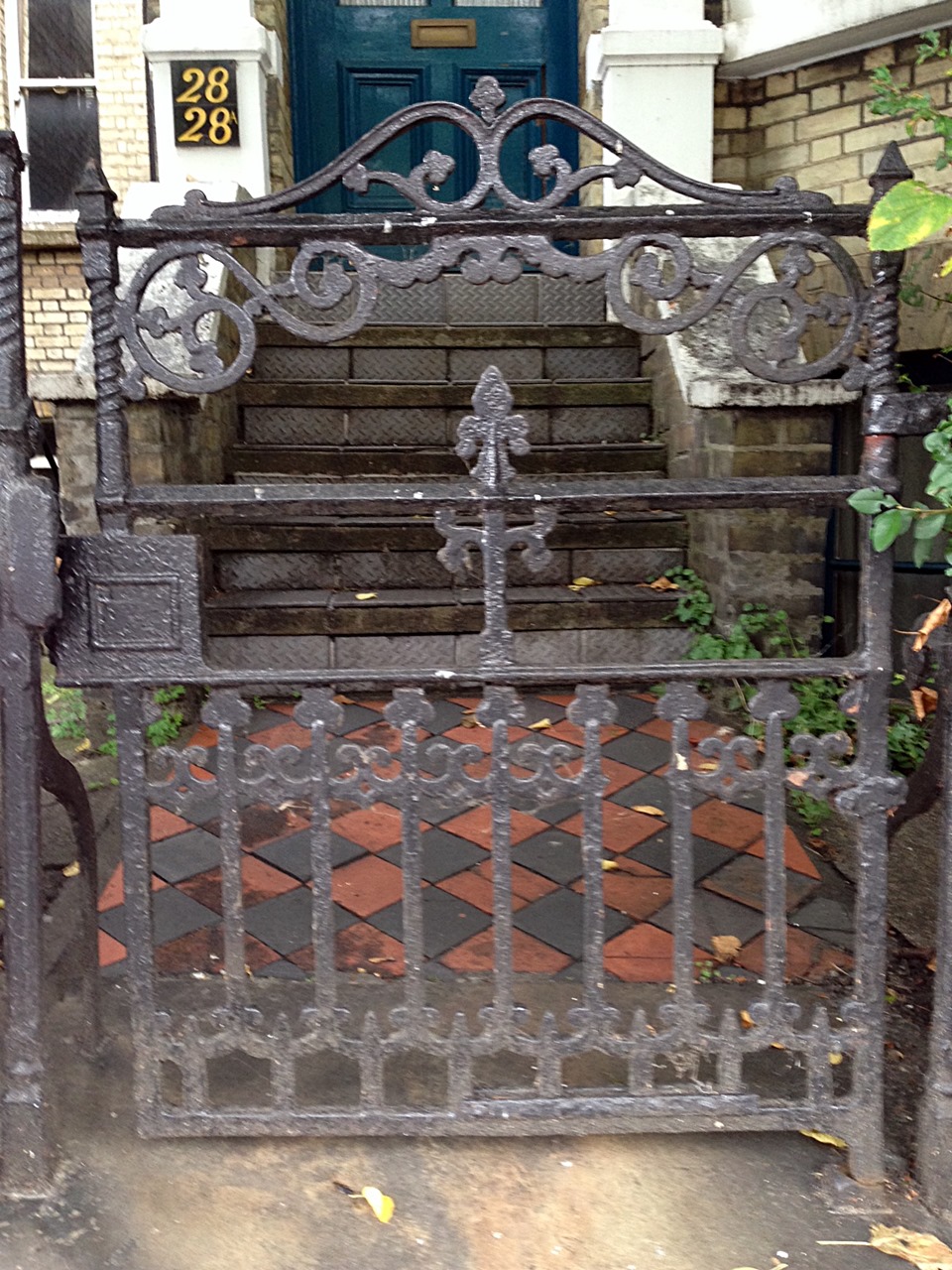 victorian original wrought iron roll back gate with old York stone quarry tile path and original London Stock brick wall Putney West Hill London# (7)