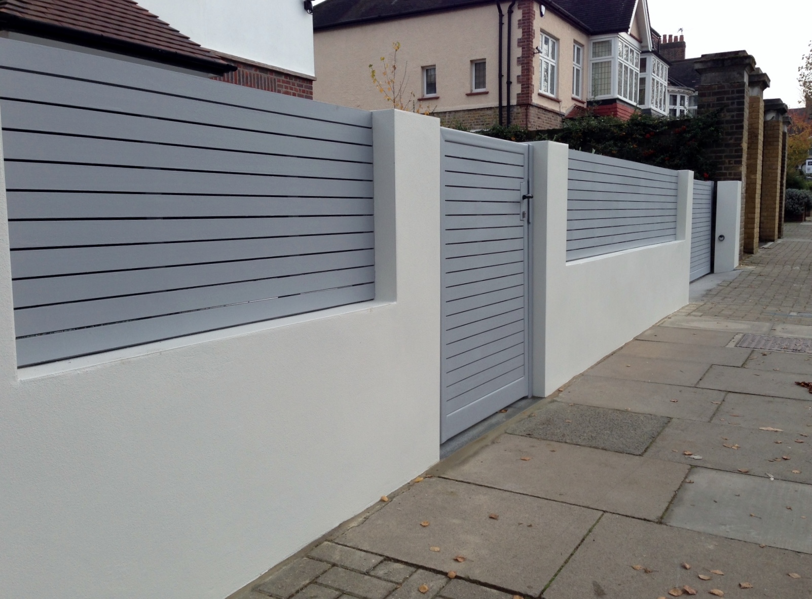 front boundary wall screen automated electronic gate installation grey wooden fence bike store modern garden design balham clapham london (3)