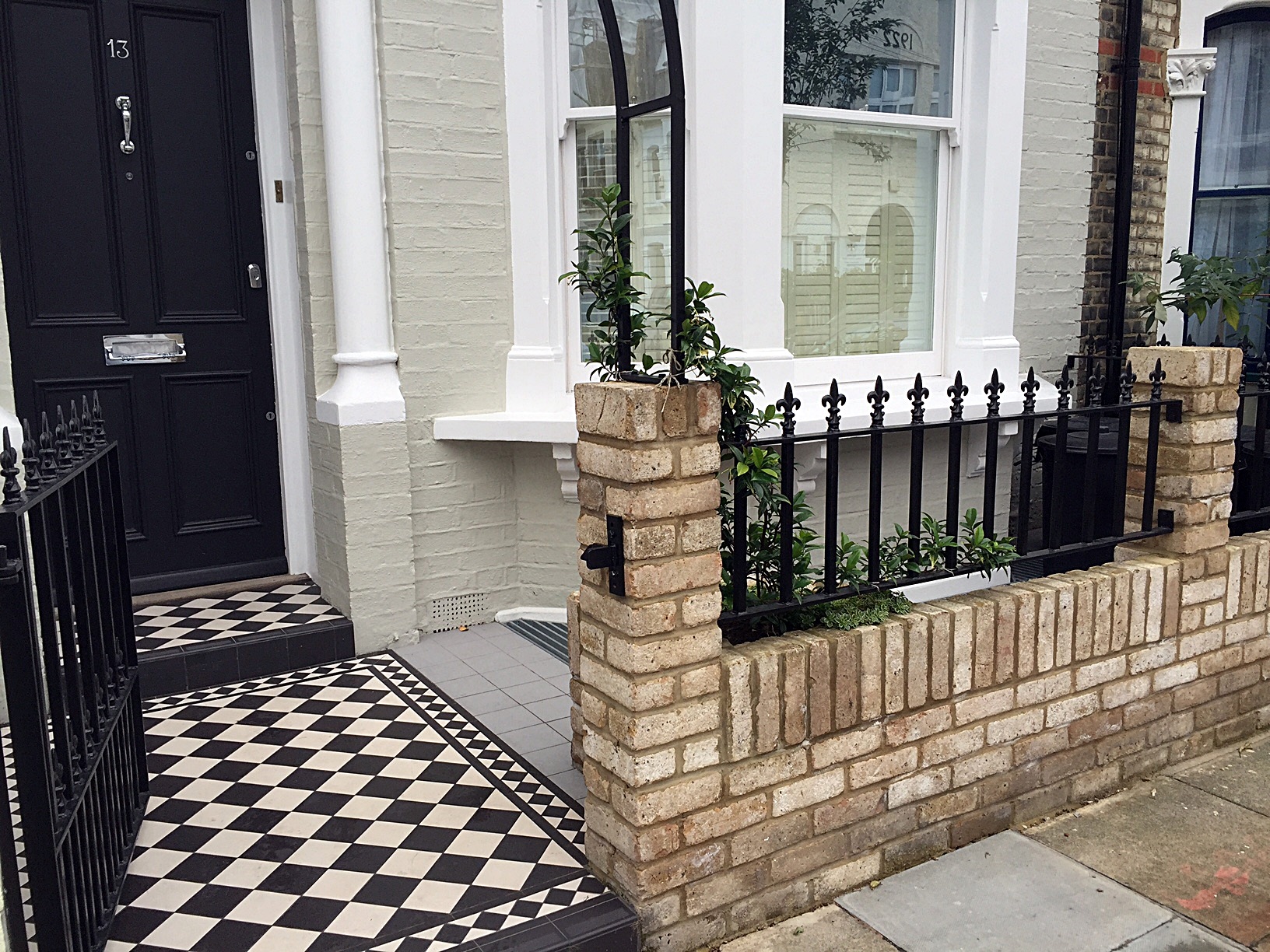 classic 100mm balck and white victorian mosaic tile path yellow brick garden wall metal garden rail rose arch fulham putney chelsea london