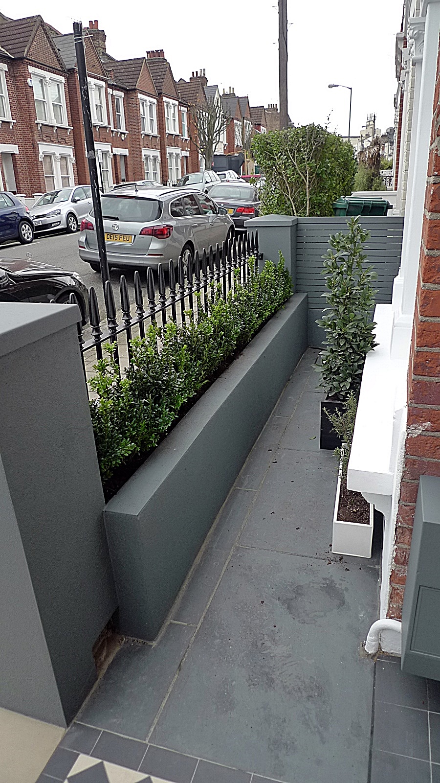 Grey walls metal rail tile planting design modern formal Balham Clapham Wandsworth Londob