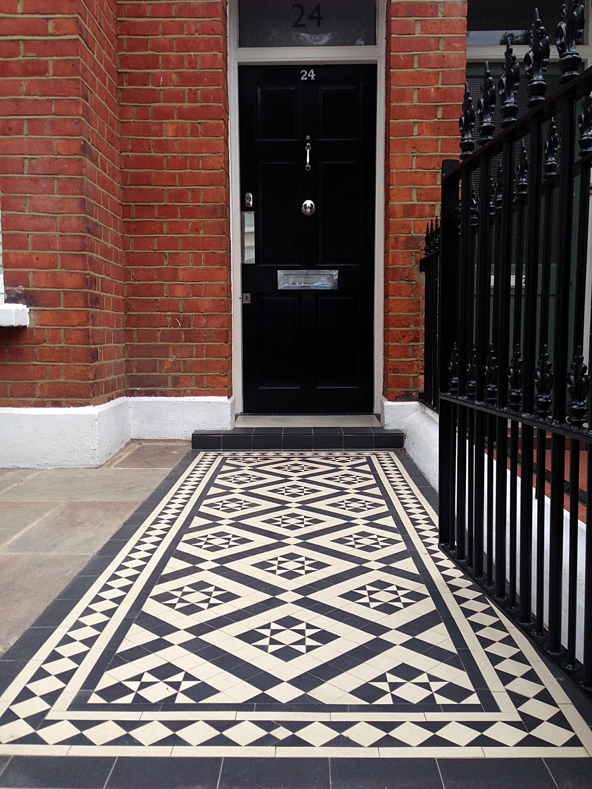 red brick front garden wall yellow stone caps sandstone paving victorian mosaic lambeth southwark tile path london