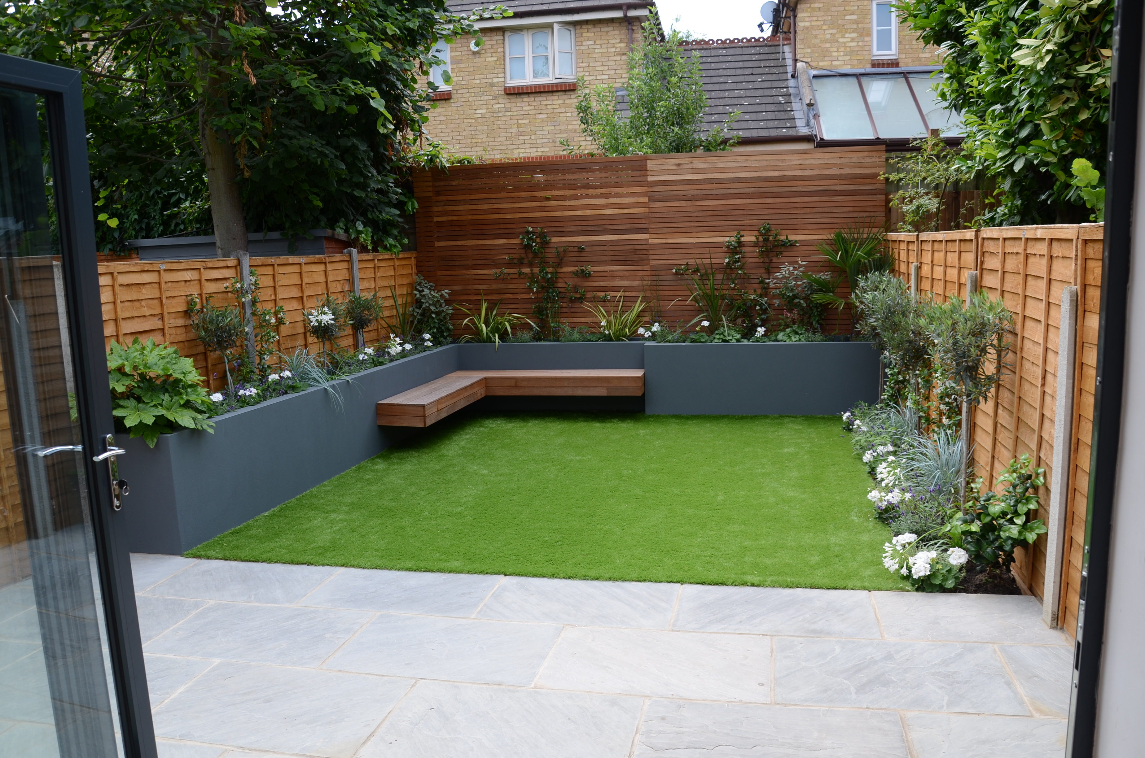 small garden design fake grass low mainteance contempoary design sleek fun london designer